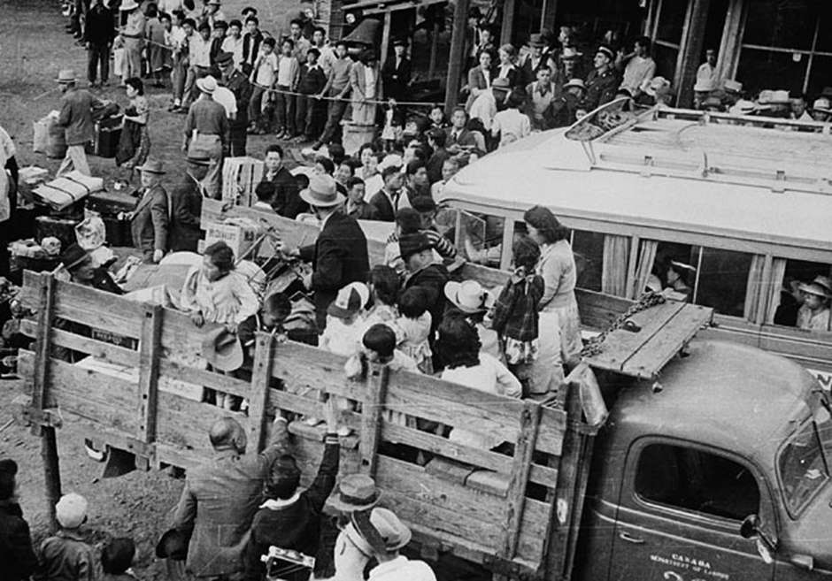 JJapanese-Canadians load into the back of trucks for relocation to camps in the interior of British Columbia. Source: Library and Archives Canada